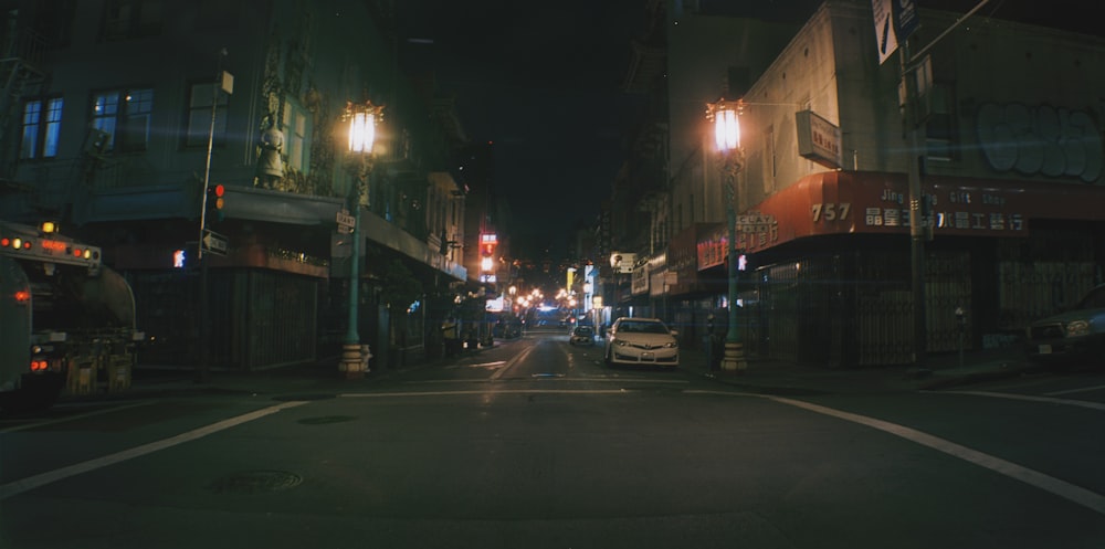 a street with cars and buildings on either side of it