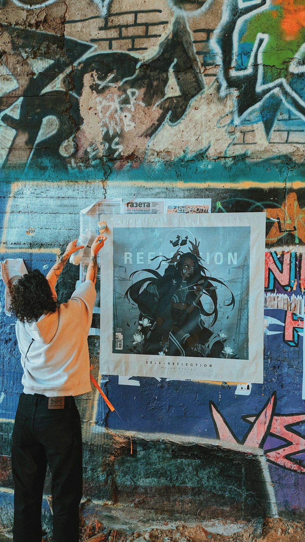 a person painting a wall