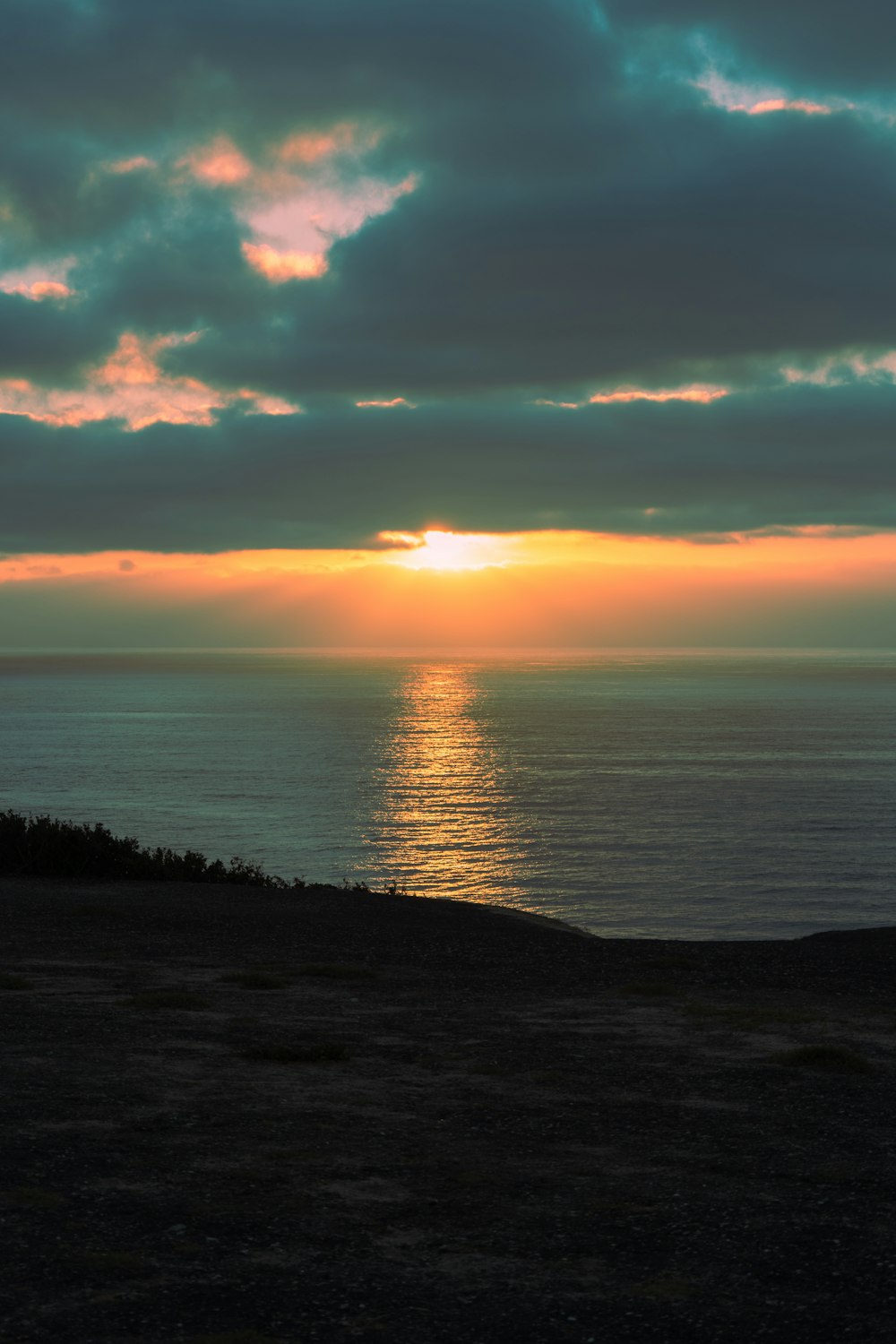 a sunset over a body of water