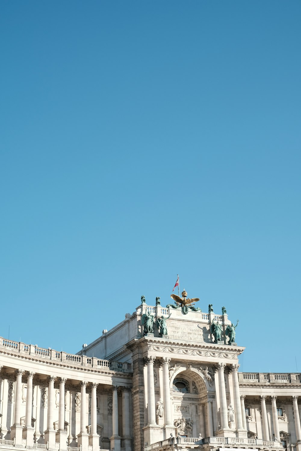 a building with columns and statues