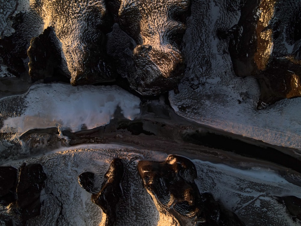 a rocky area with snow