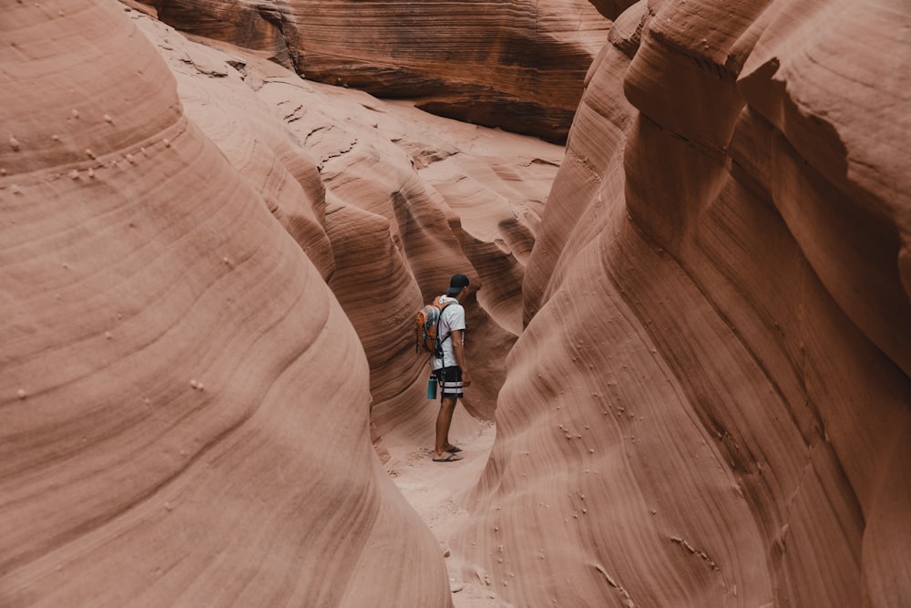 a person standing in a canyon