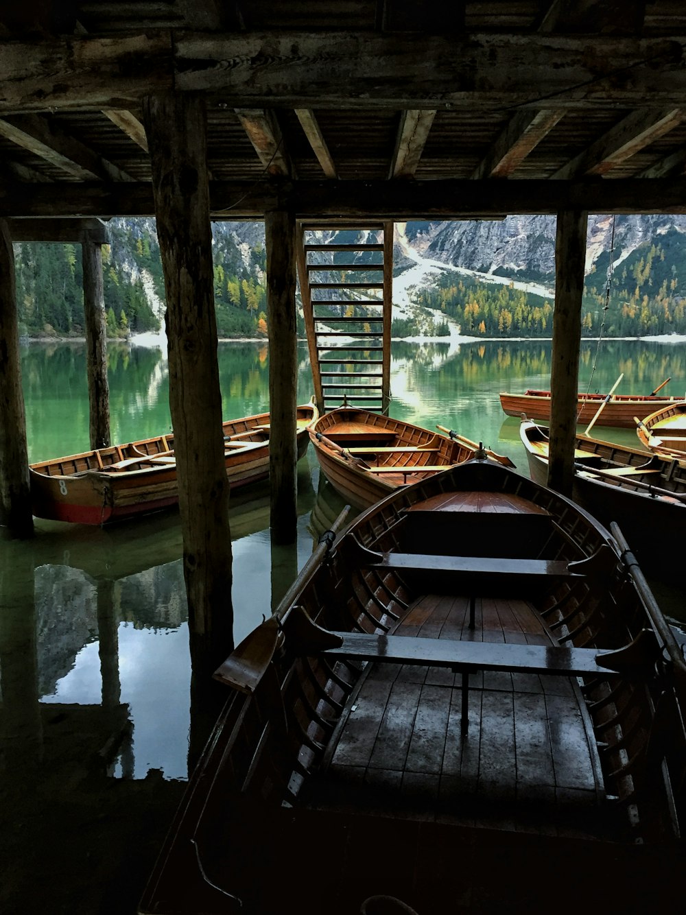 a wooden boat in a lake
