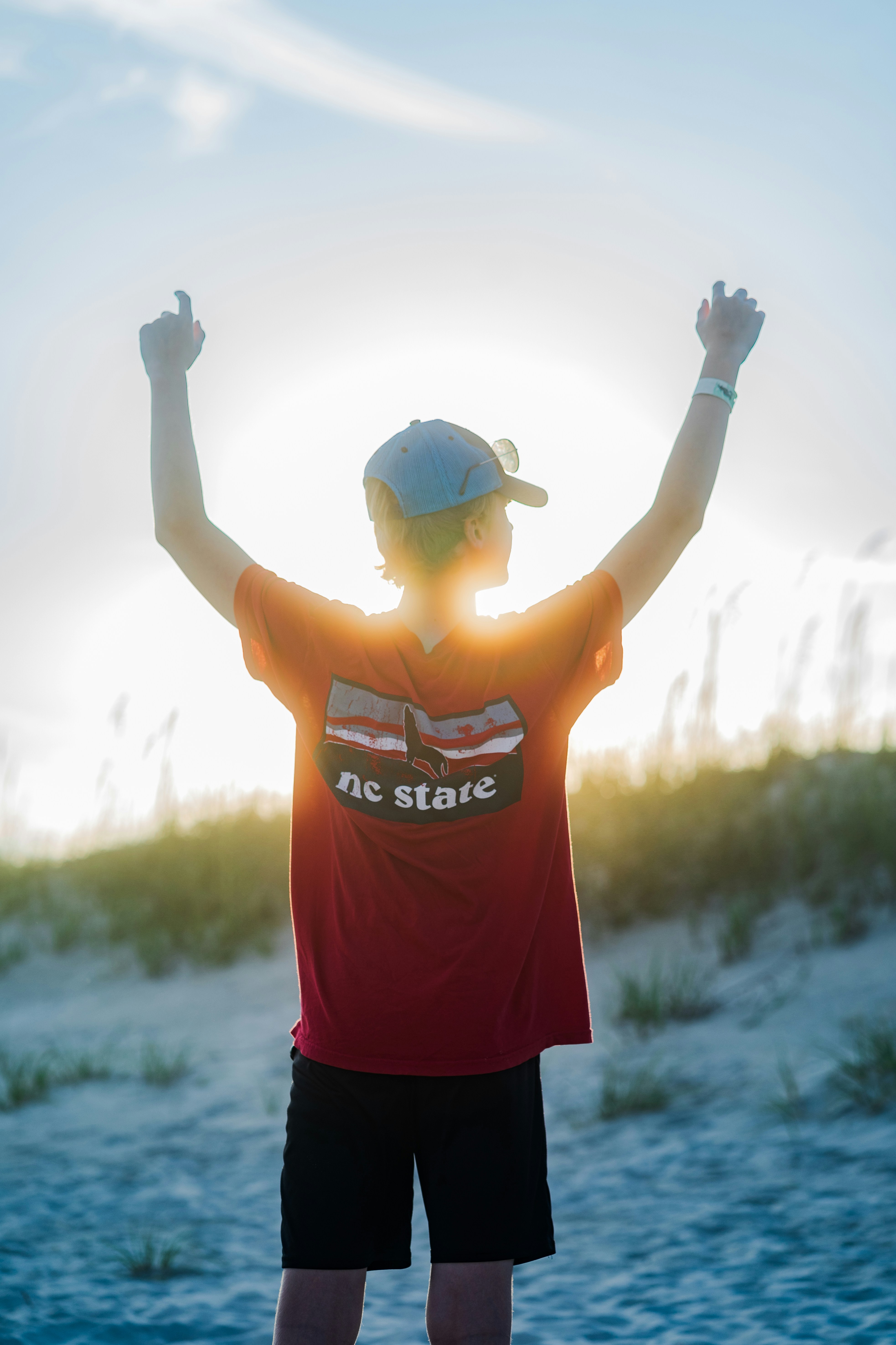 a person with the arms raised