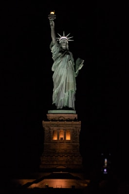 a statue of a person holding a torch