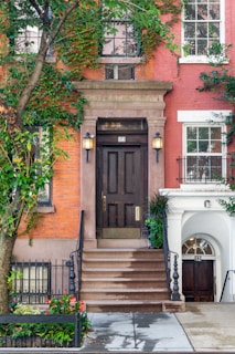 a building with a large door and a staircase
