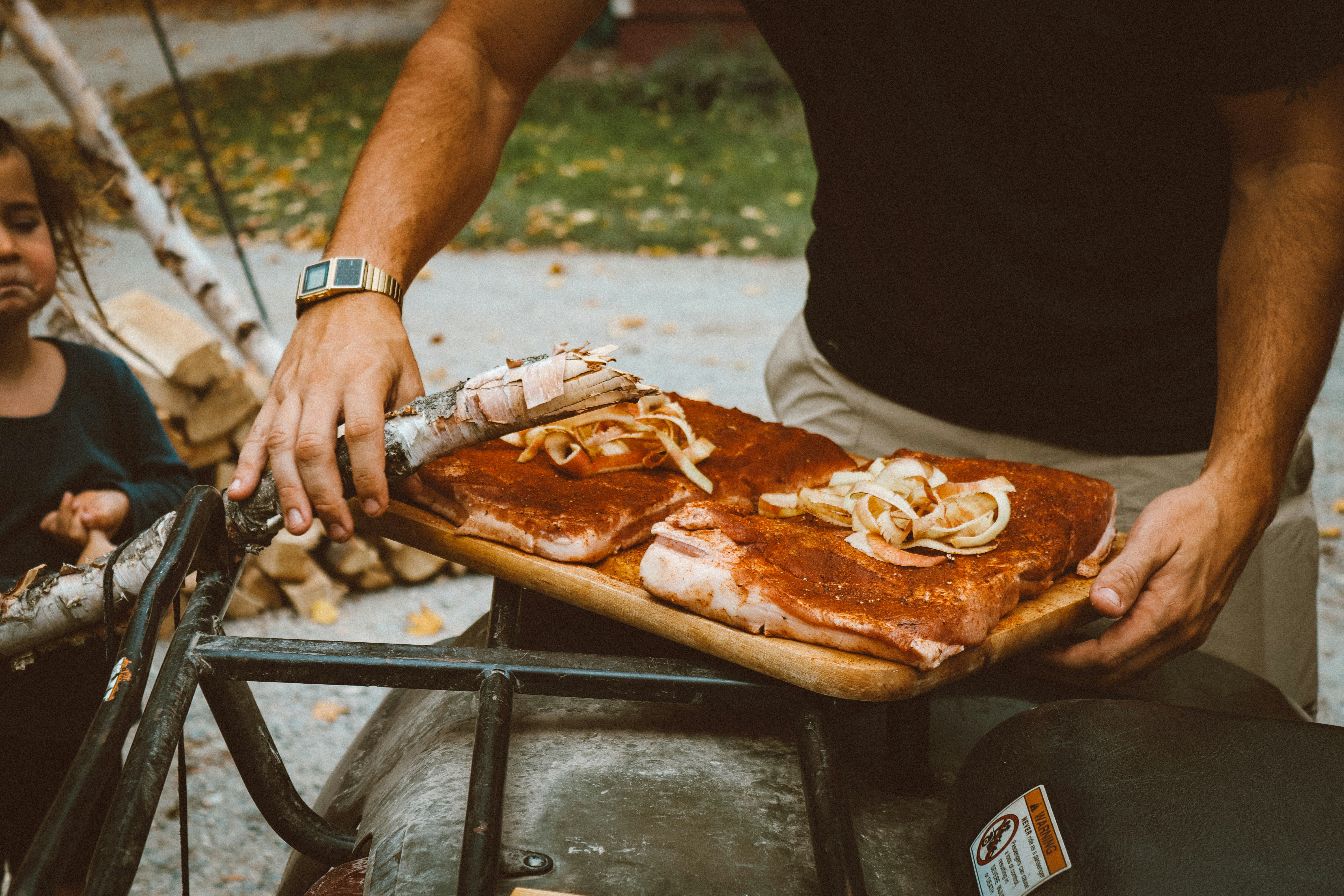 a man holding a pizza