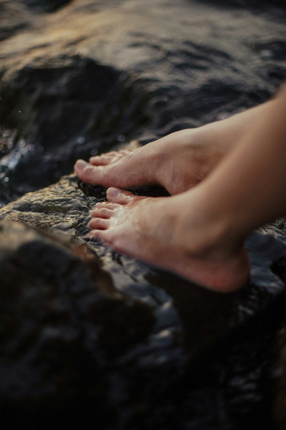 a person's foot in the water