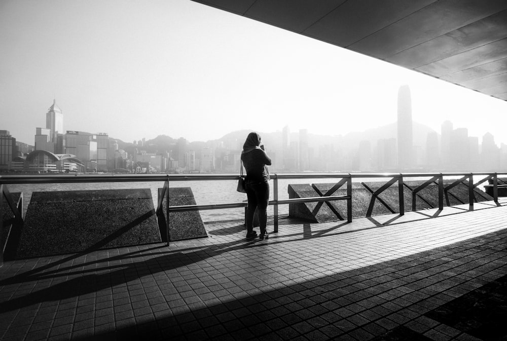 a person standing on a bridge