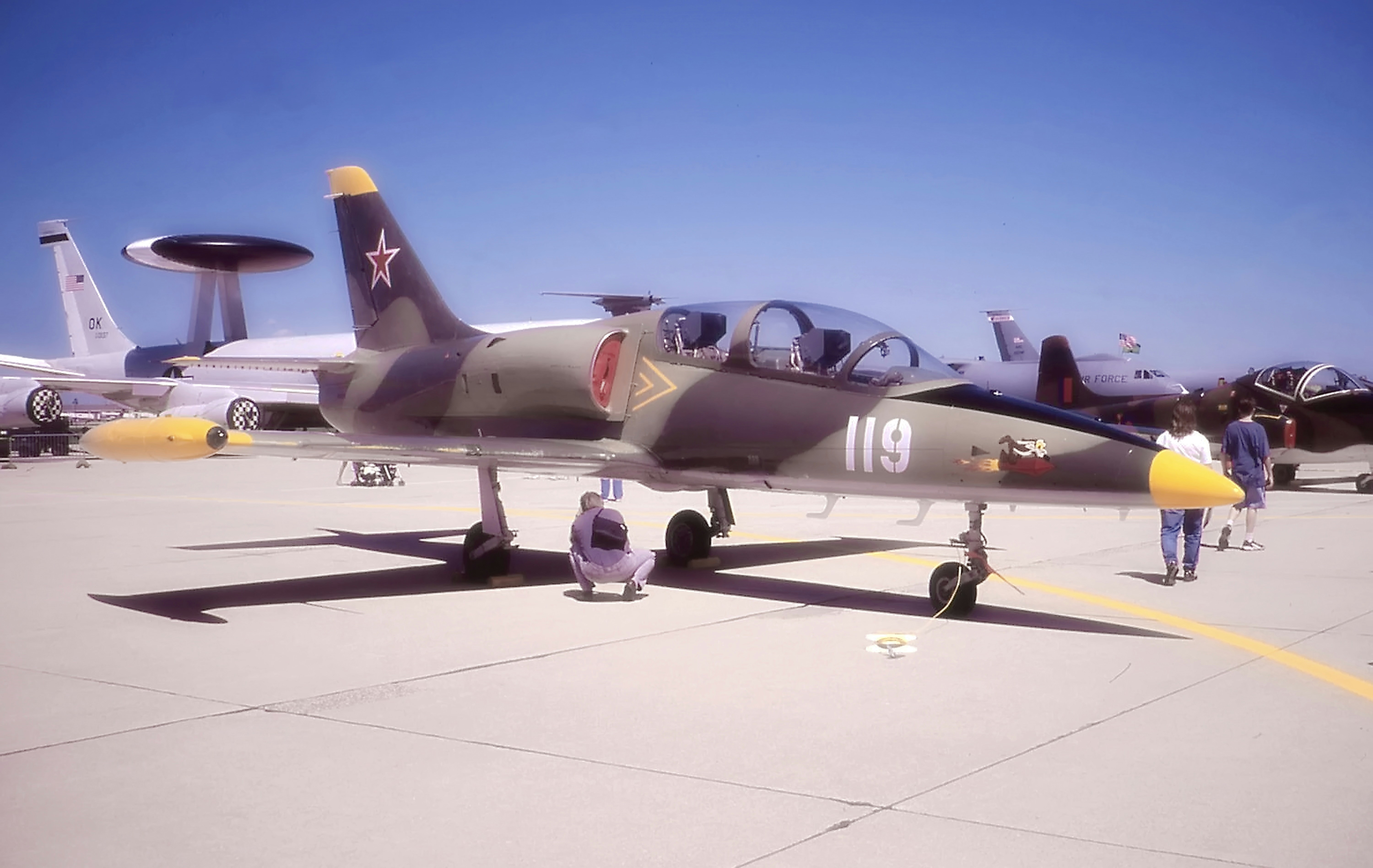 a group of jets on a runway, Russian MiG-17 Jet Trainer. Photo was made from scanned 35mm film.