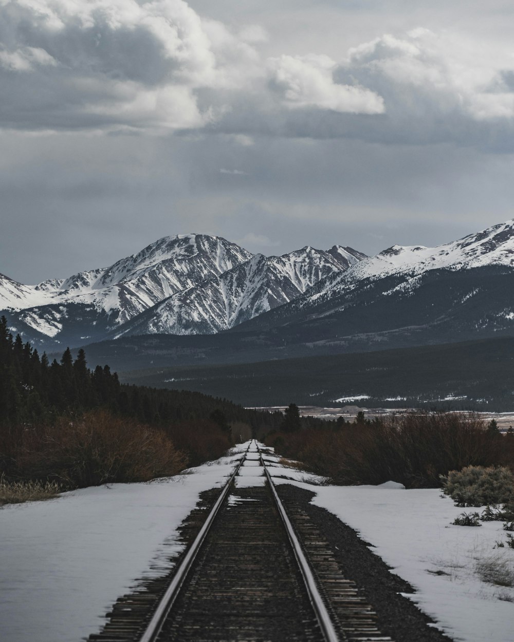 train tracks going through a snowy landscape