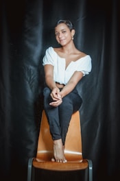 A serene individual sitting comfortably in a counseling session, expressing openness.