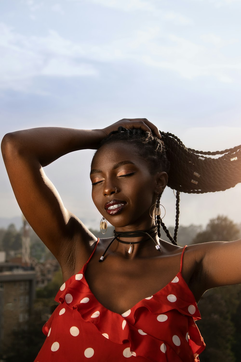 a girl with her hands on her head