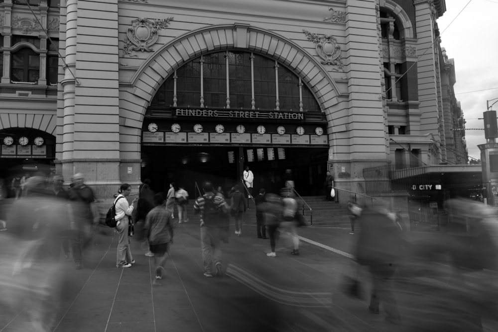 a group of people walking on a street