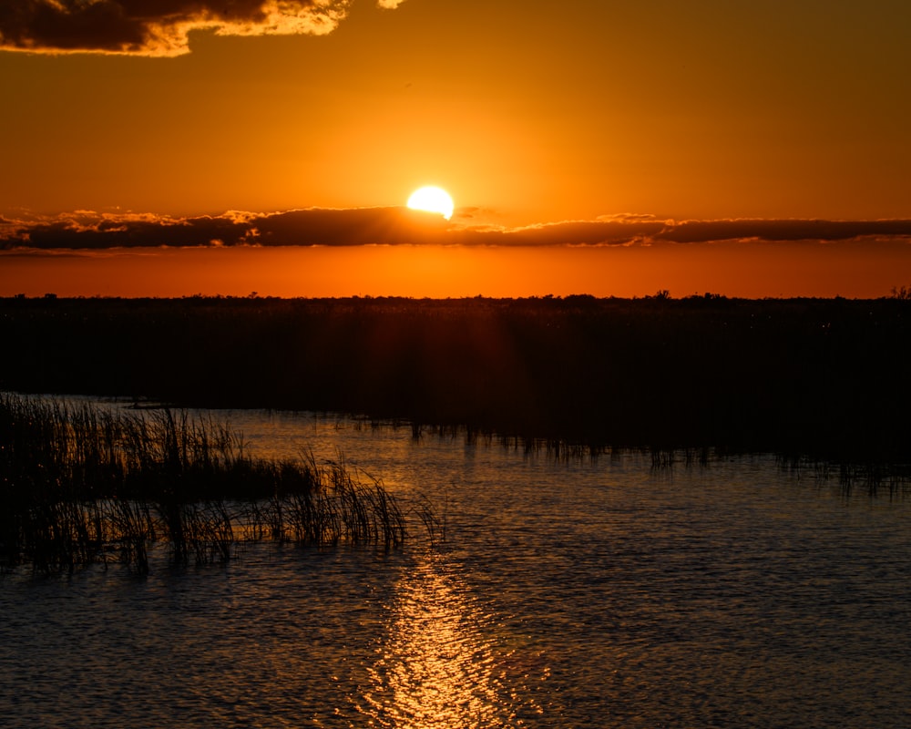 a sunset over a lake