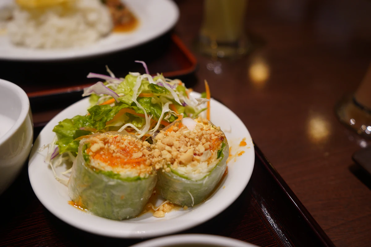 A Thai restaurant plate with rice and vegetables, illustrating the Thai Dumplings guide