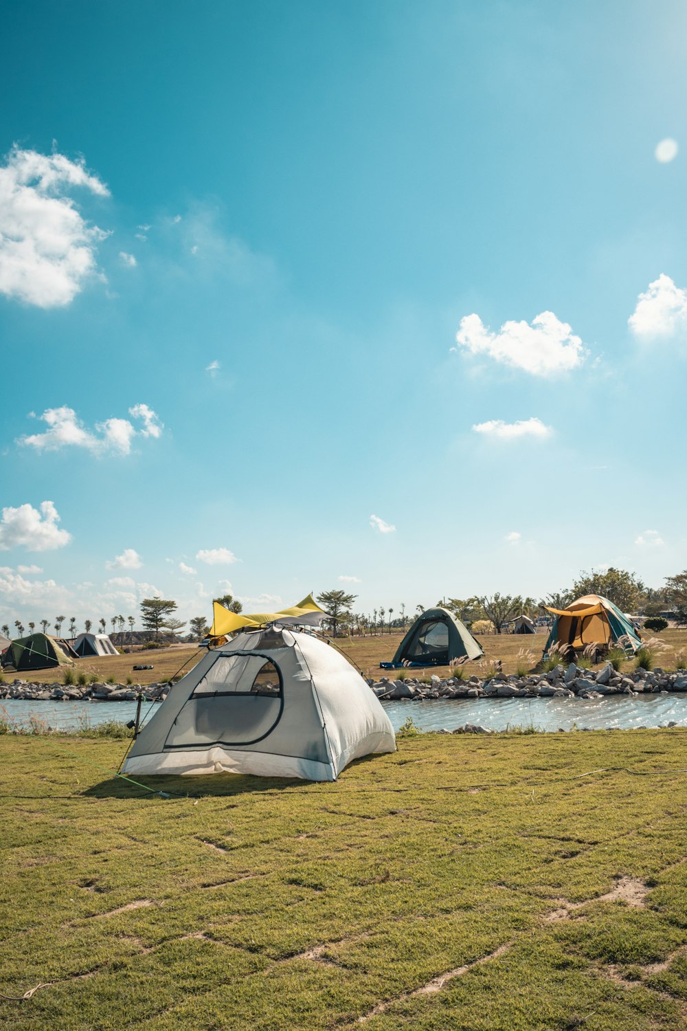 a group of tents on a field