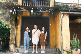 a group of people standing in front of a building