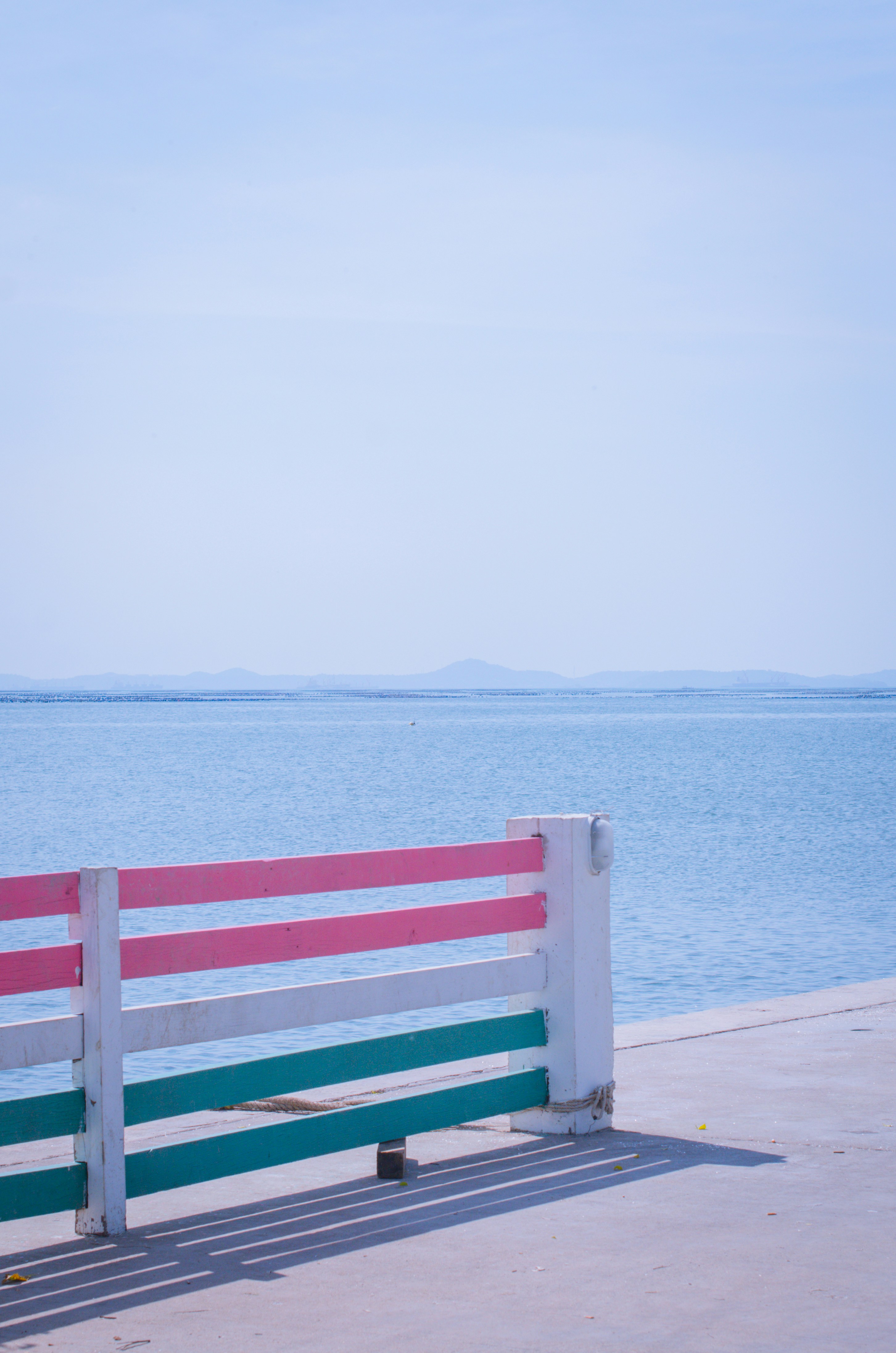 a bench sits by the water