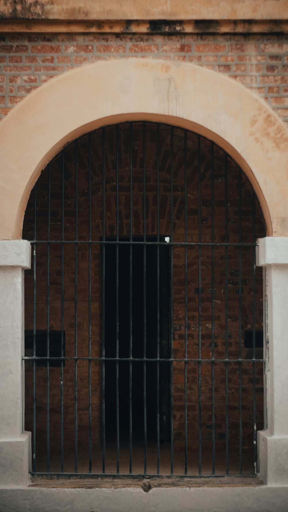 a gate in a brick building