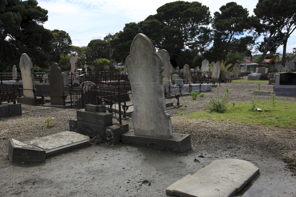 a cemetery with tombstones and trees