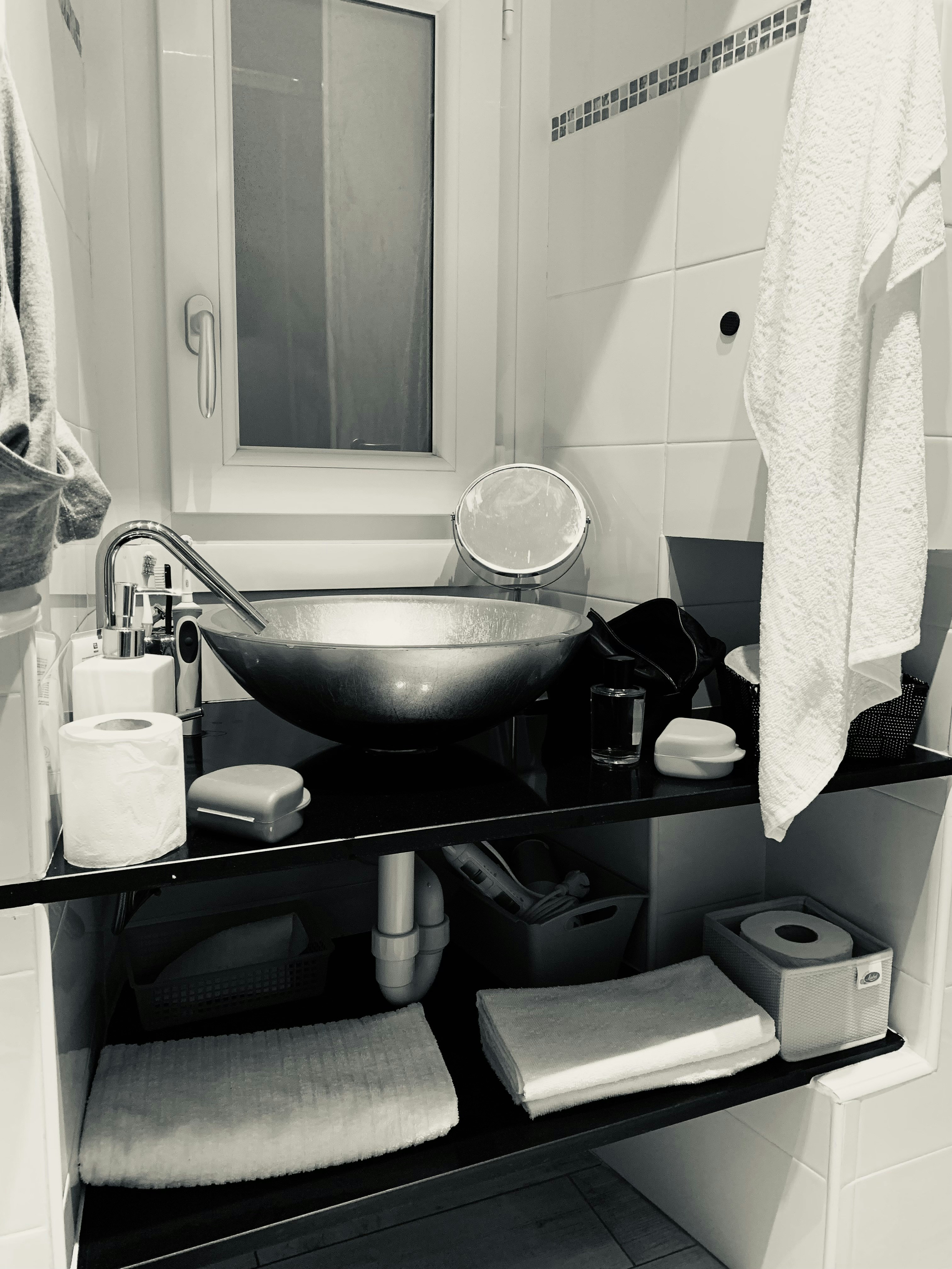 Small bathroom after complete refresh with organised storage and clean surfaces