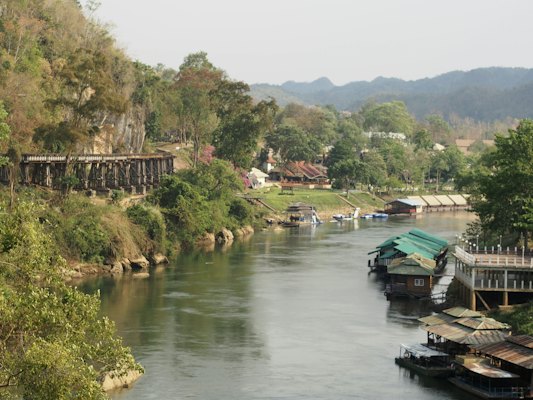 A river with boats and buildings — Kanchanaburi, Thailand
