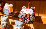 Close-up of a handmade pet accessory featuring bright, cheerful colors on a fluffy cat.