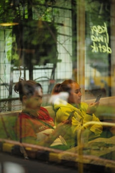 Local residents engaging with digital devices, representing the digital platform of Nagari Sitombol.