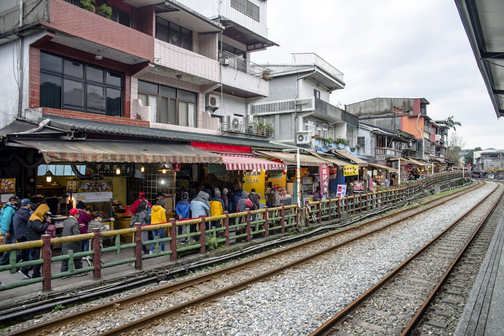 a group of people waiting for a train