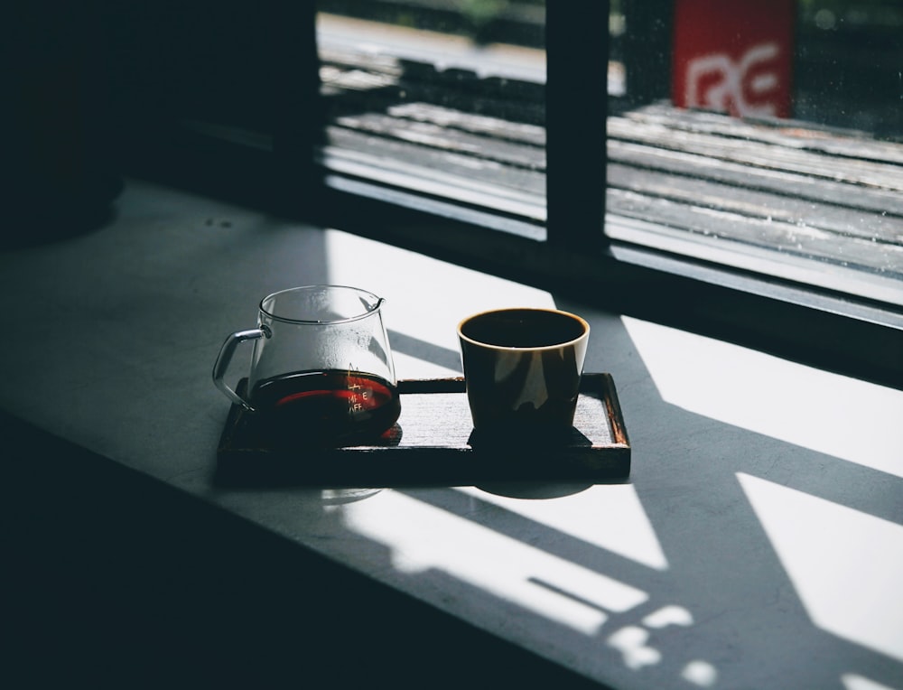 a pair of tea cups on a table