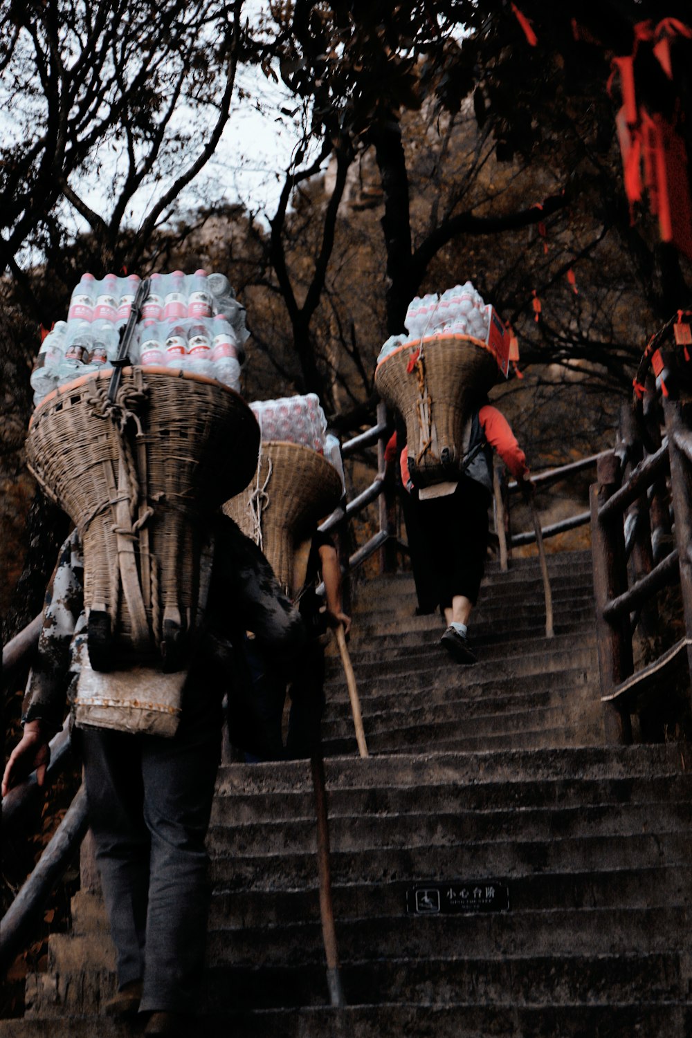 a person walking up stairs with a couple of people in clothing