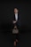 a person in a suit holding a briefcase