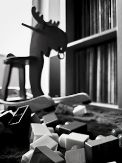 A charming wooden rocking horse with faded paint, placed in a cozy corner with soft lighting.