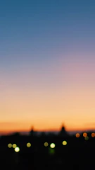 A blurred city skyline at dawn hinting at new beginnings.