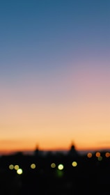 A softly blurred cityscape at dawn, suggesting new beginnings and anticipation.