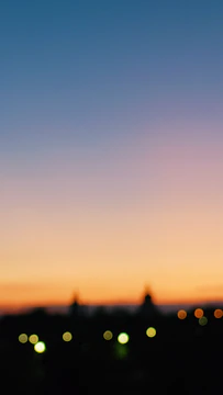 A blurred city skyline at dawn hinting at new beginnings.