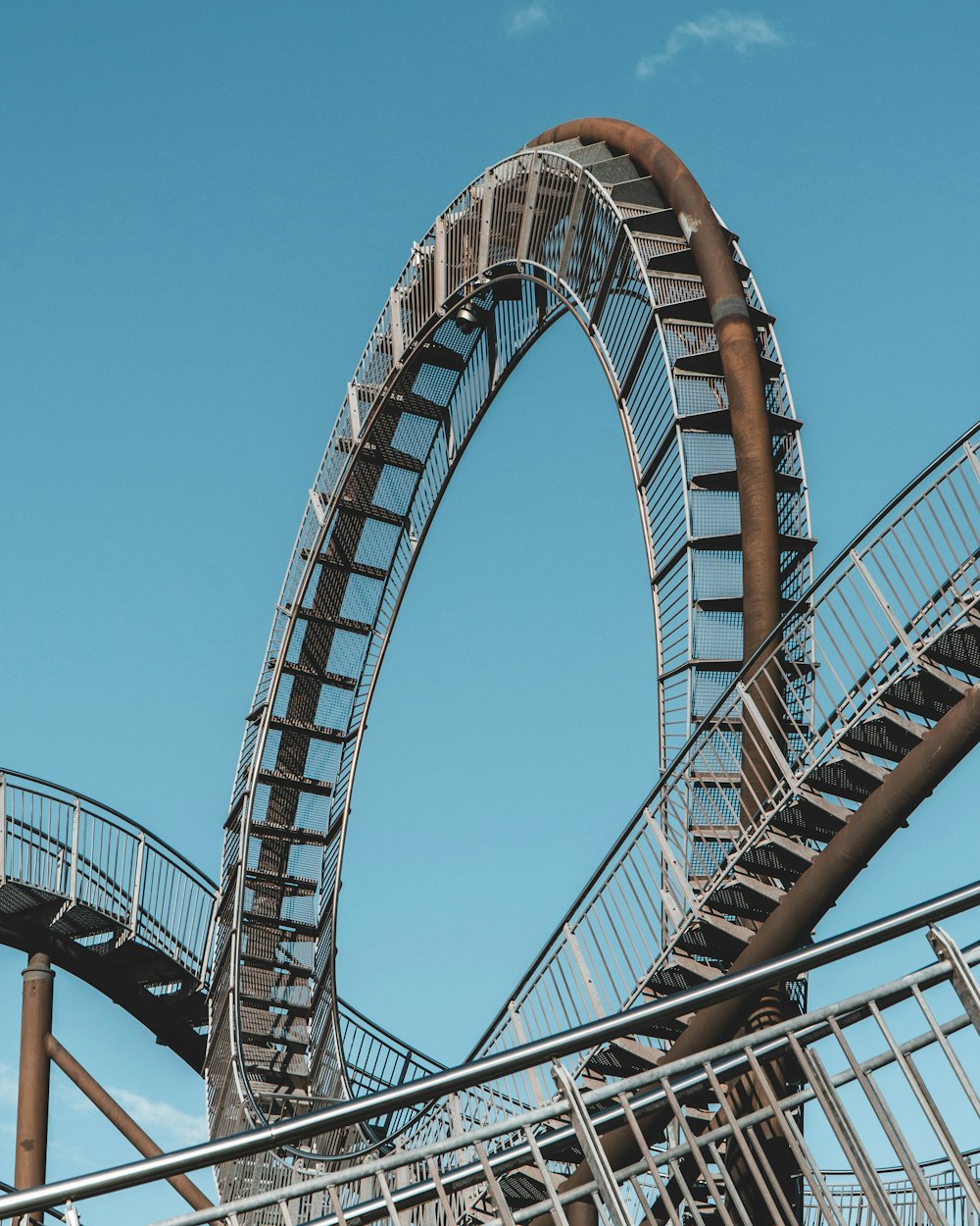 a roller coaster with a blue sky