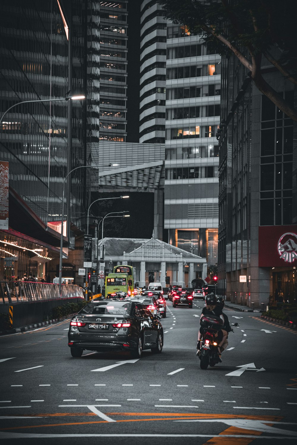 a busy street with cars and people