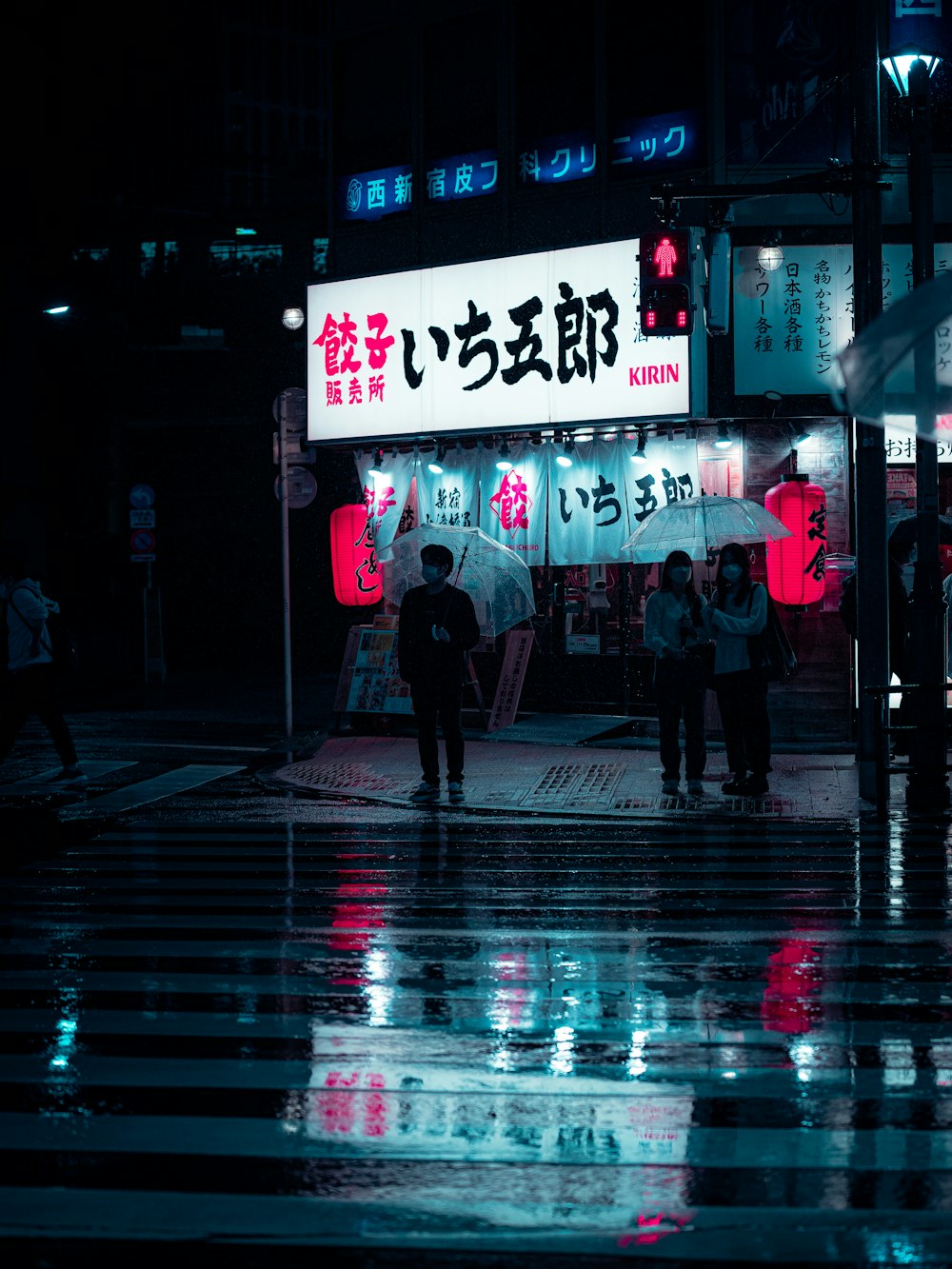 people walking in the rain