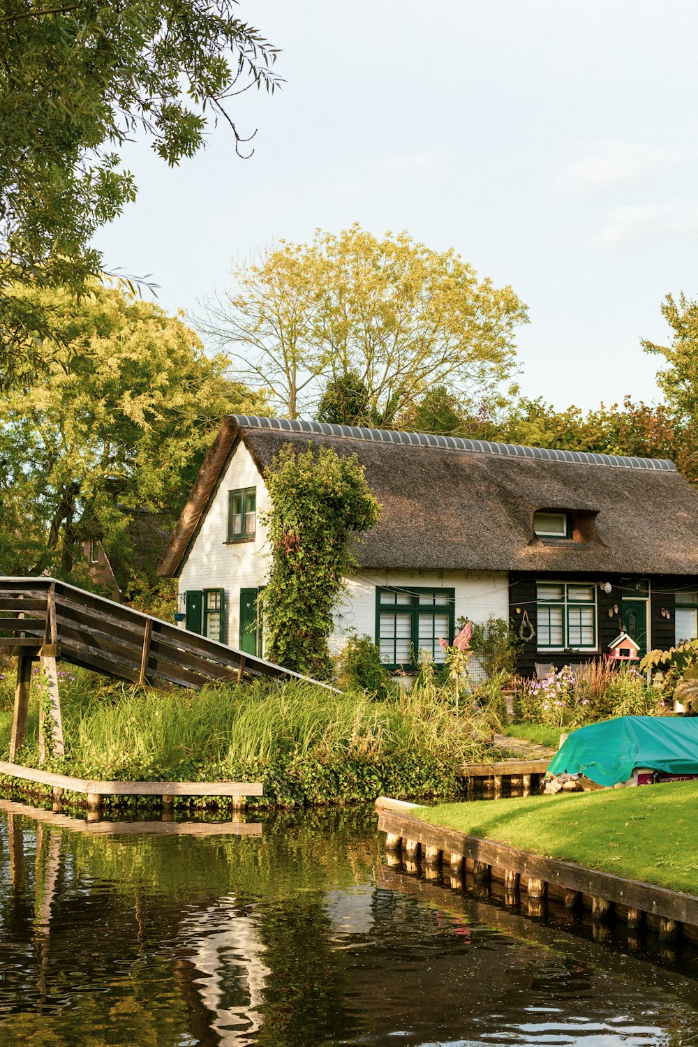 a house with a pond in front of it