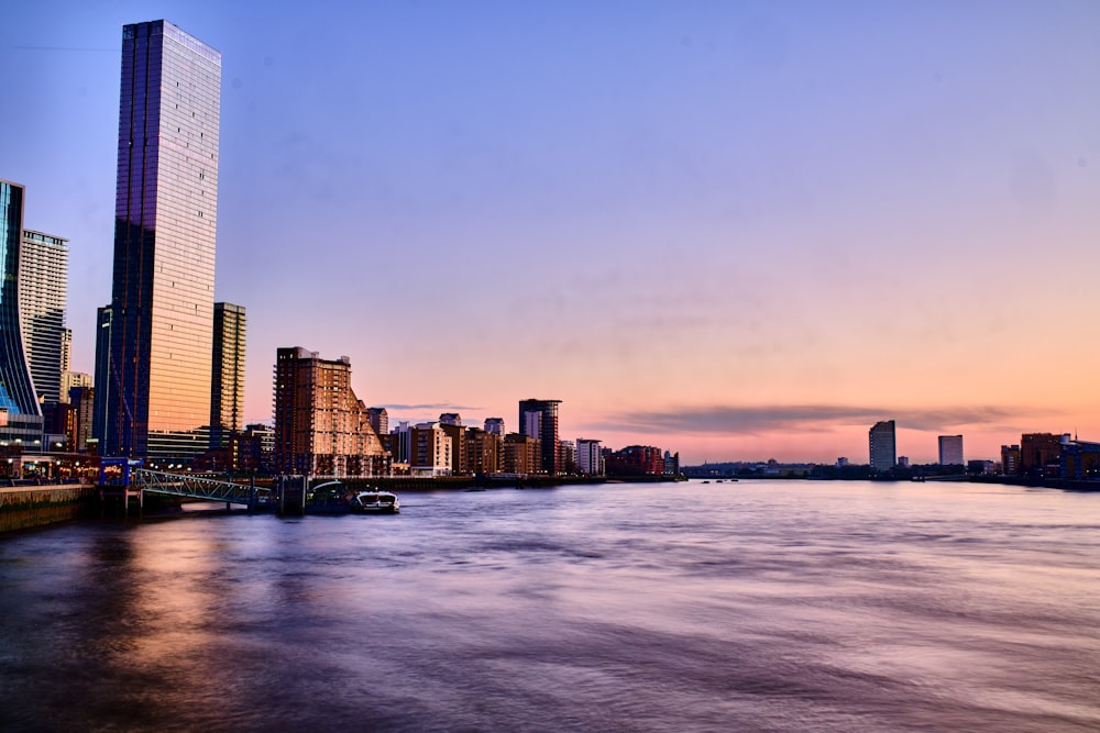 a city skyline with a river