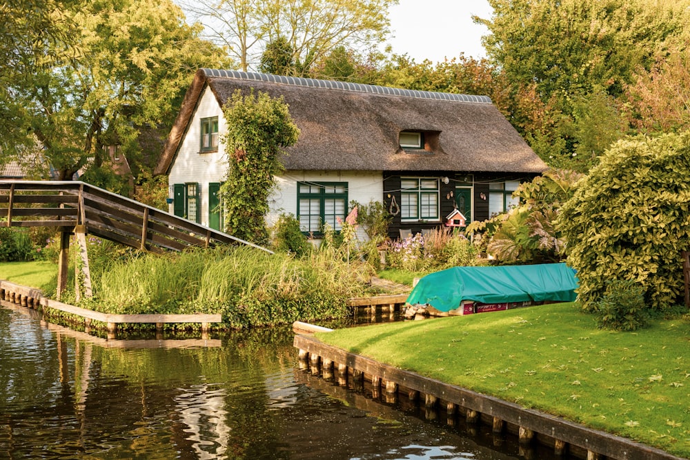 a house with a pond in front of it