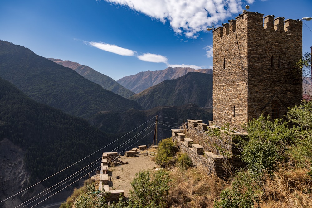 a stone castle on a hill