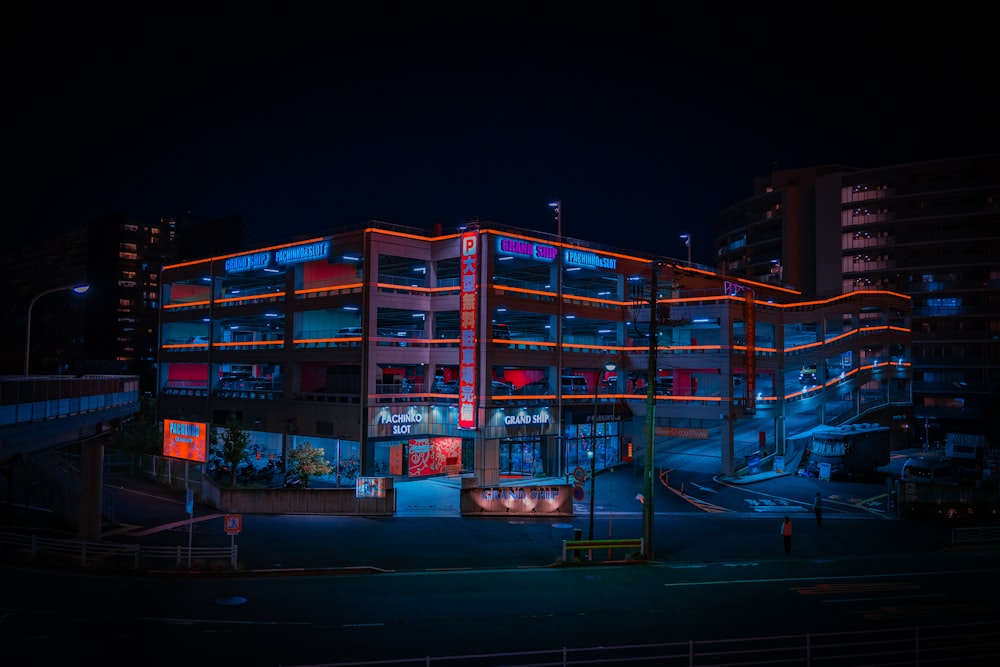 a building with neon signs at night