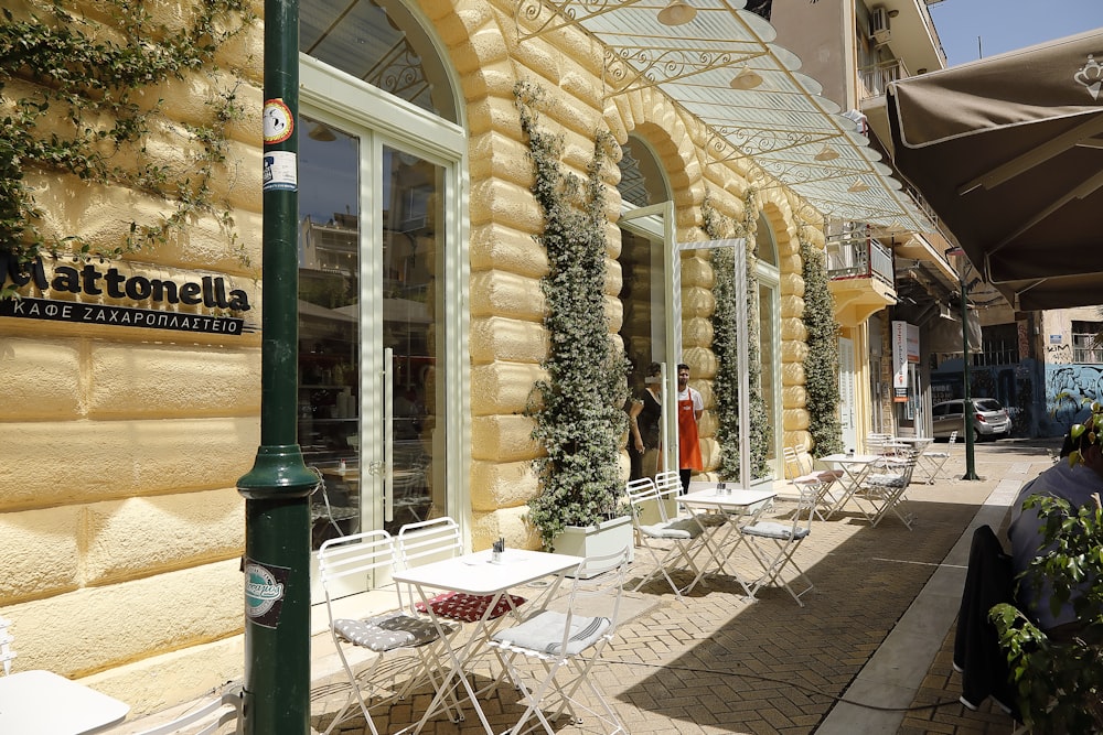 a building with tables and chairs outside