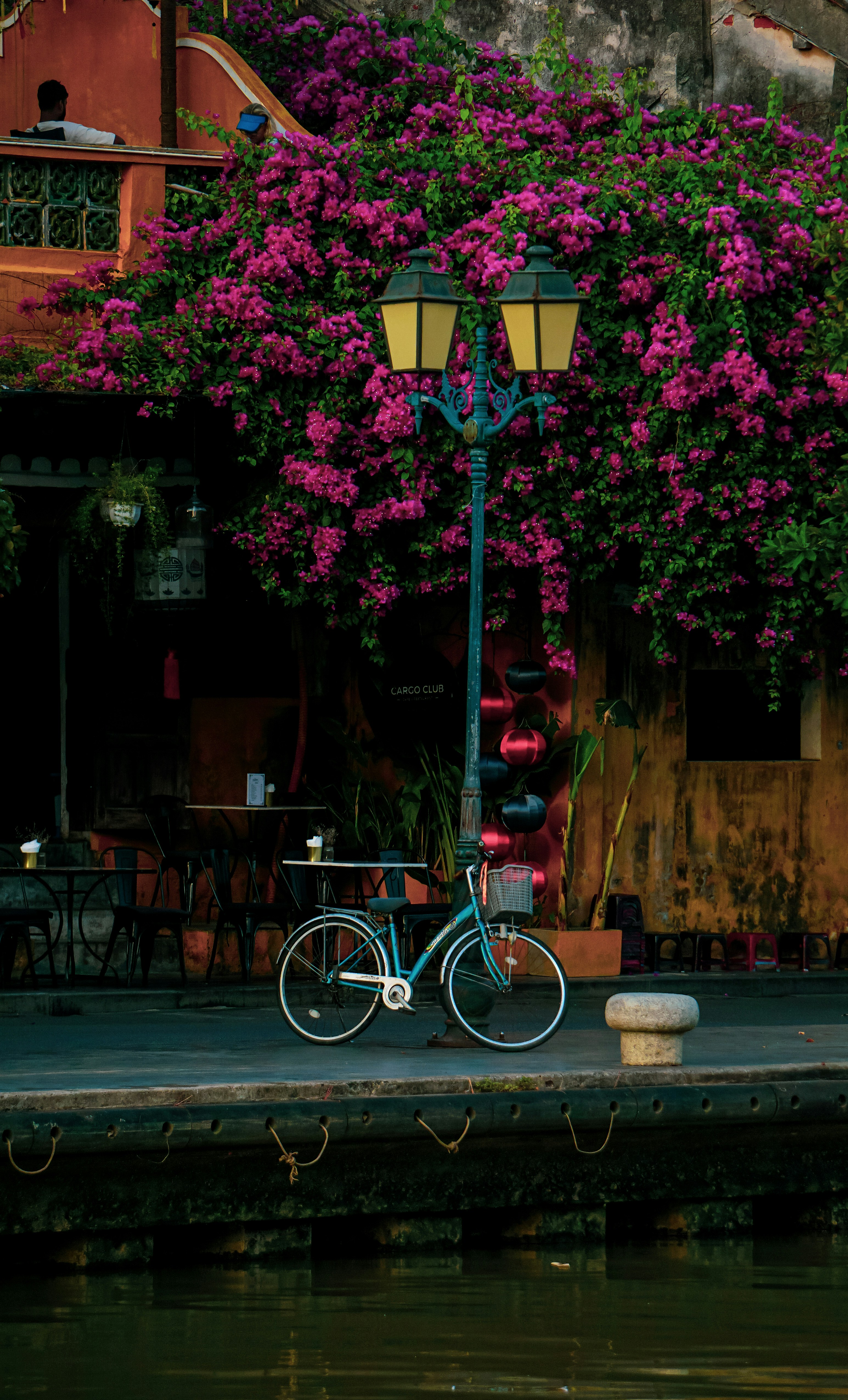 a bicycle parked on the side of a street
