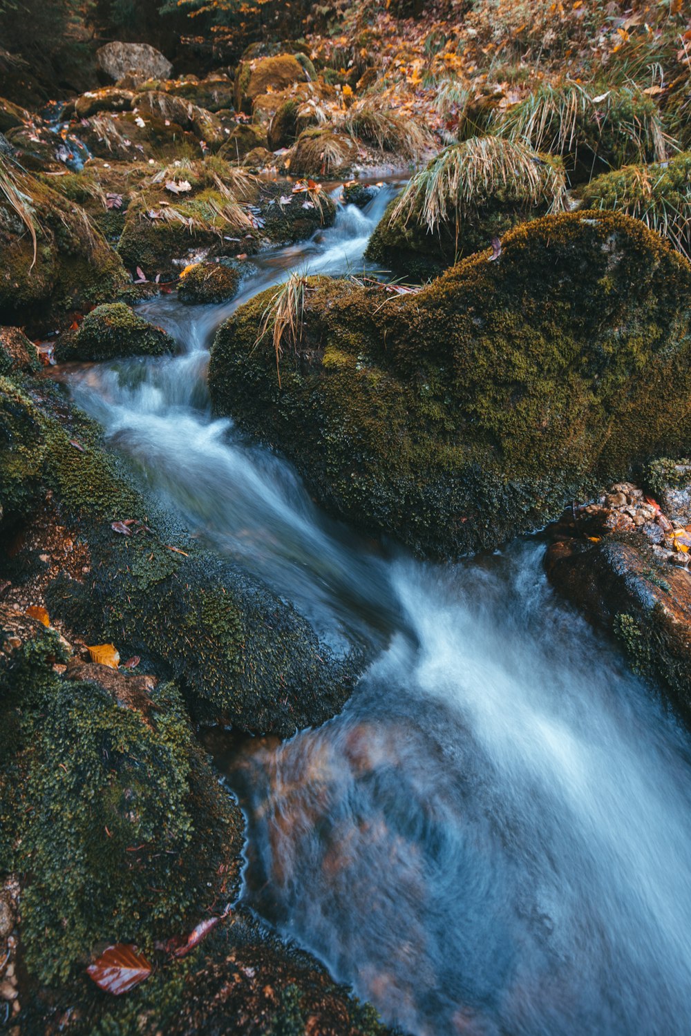 a stream of water flowing over rocks