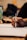 Close-up of hands holding a notebook and pen during a counseling session.
