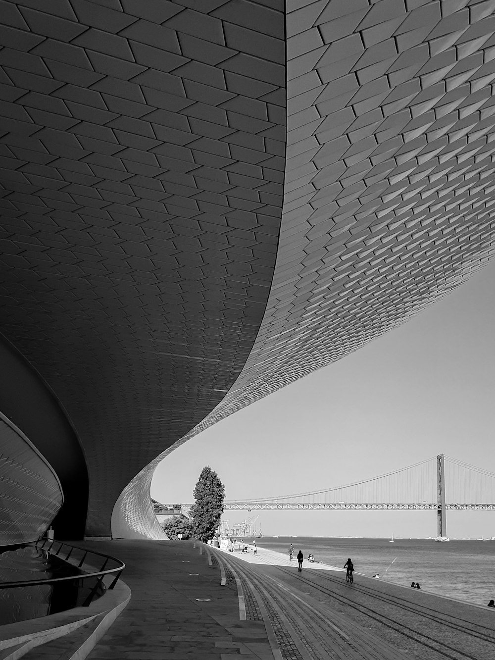 a bridge with people walking on it